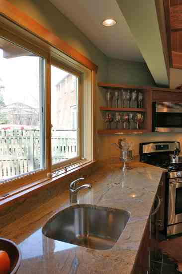 AFTER: The kitchen is furnished with water- and energy-saving appliances.